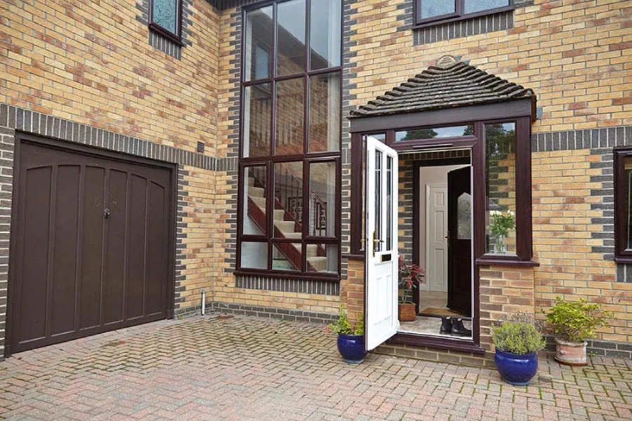 Dual Dark woodgrain White UPVC porch front door open