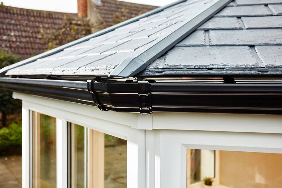 Solid roof conservatory replica slate tiles close up