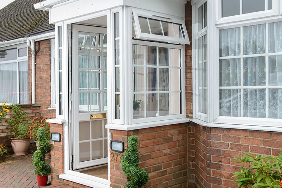 White UPVC porch georgian bars open front door