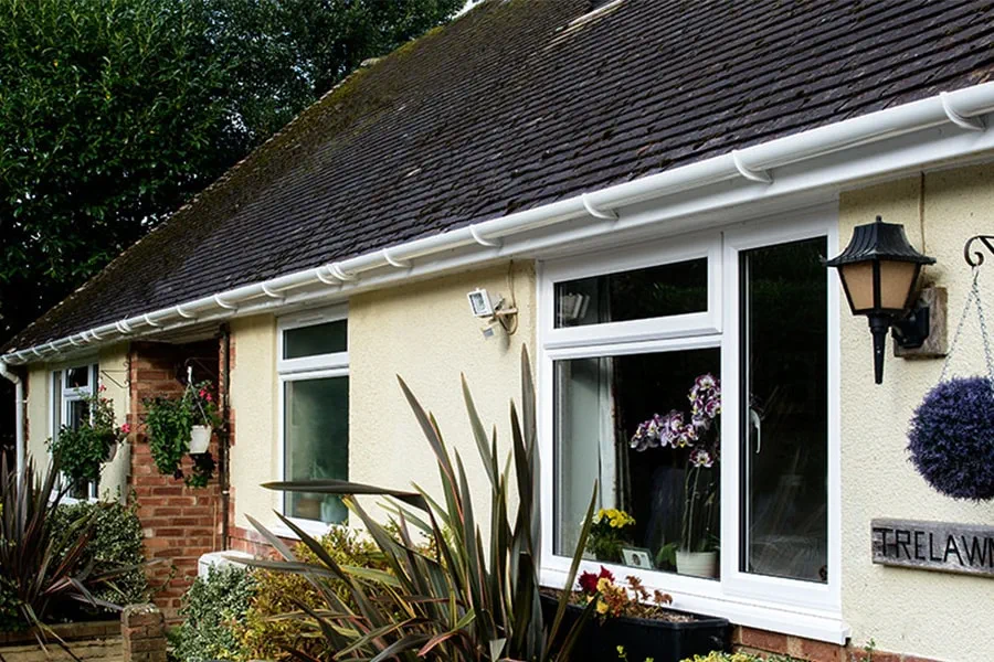 White uPVC guttering downpipes front