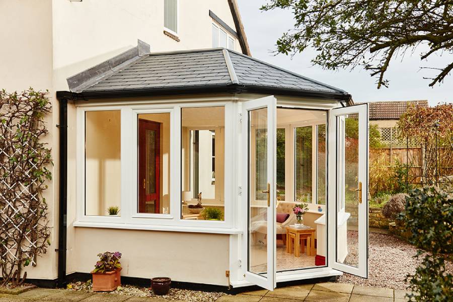 White uPVC solid roof conservatory tiled roof